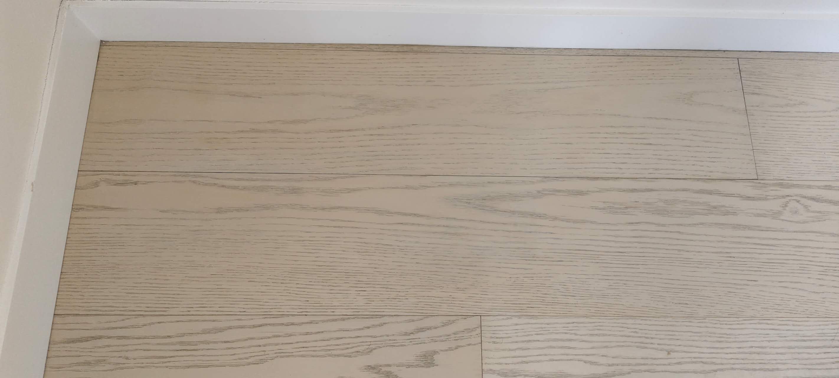 The completed invisible timber floor repair in Macquarie, showing seamless integration with original planks.